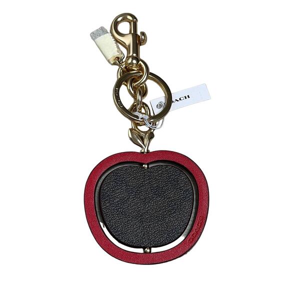 Coach Handbags - Coach Spinning Apple Bag Charm in Signature Canvas Keychain